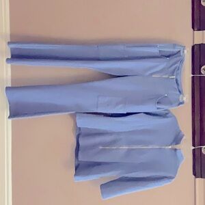 These designer scrubs are used and are a classic light blue